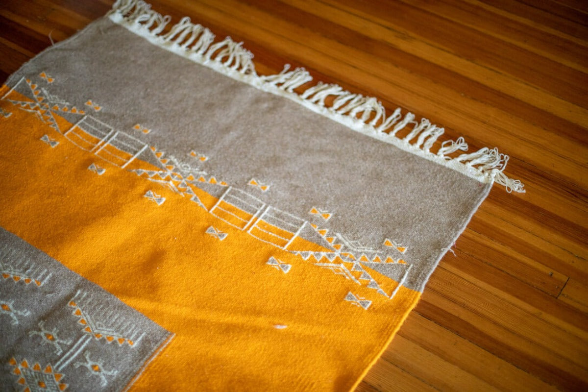 Gray and mustard area rug