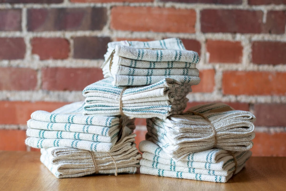 Stack of cloth napkins made with handspun cotton.