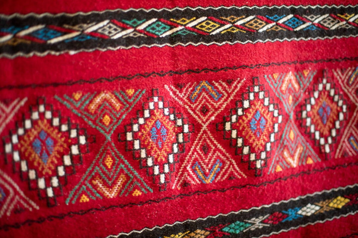 Red rug with geometric patterns