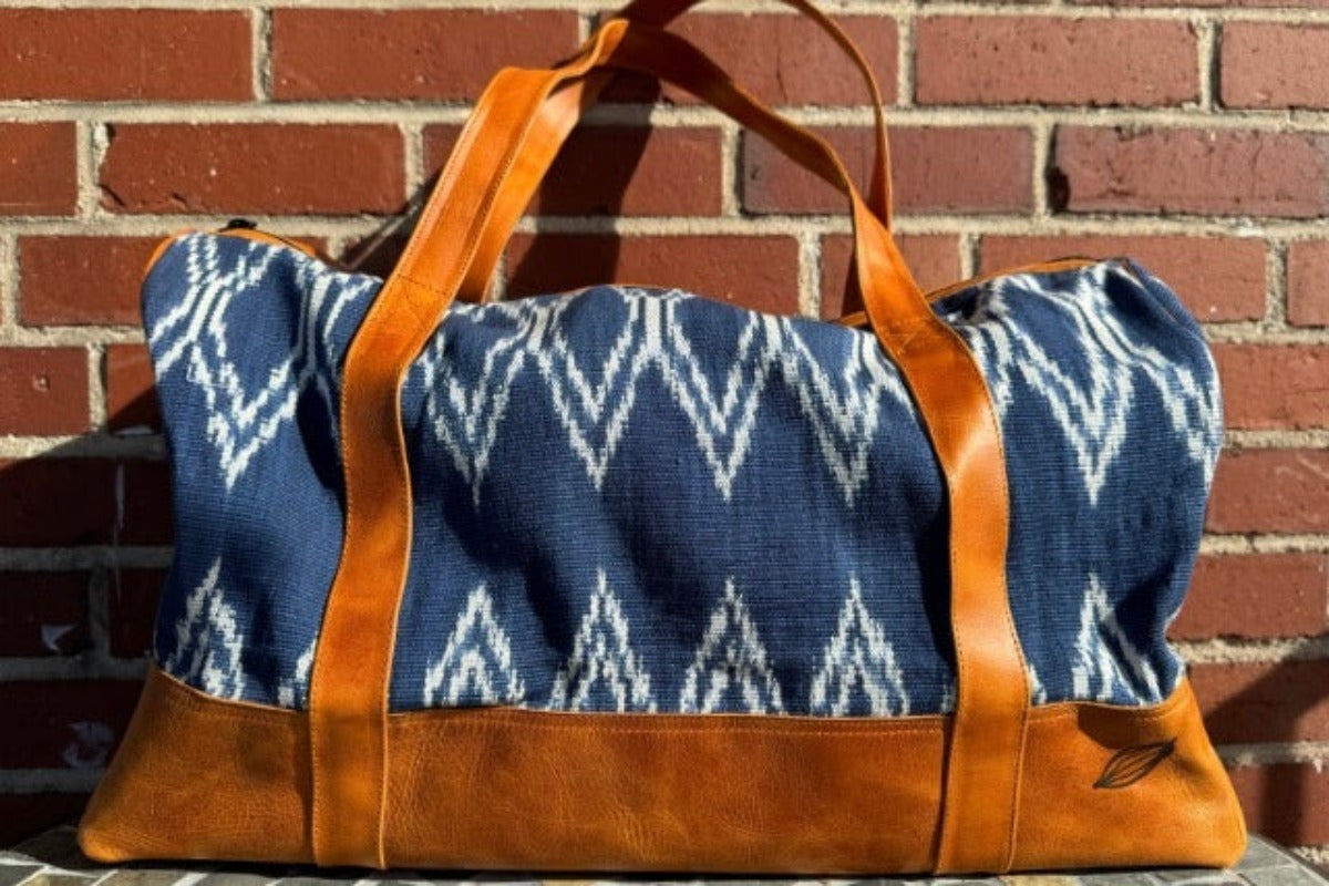 Blue duffel bag with genuine leather.