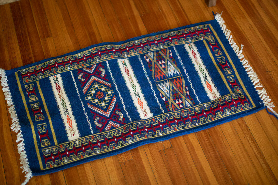 Blue rug with geometric patterns
