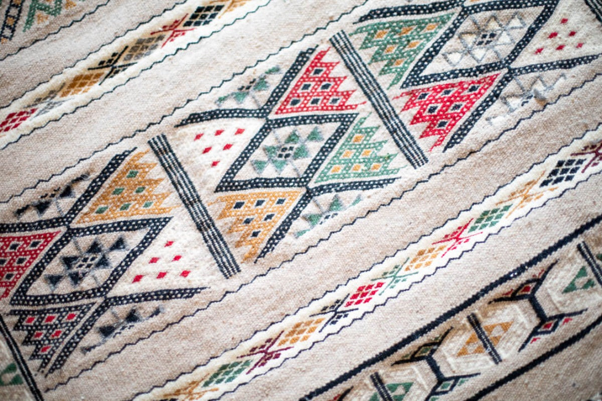 Gray Berber rug with colorful motifs