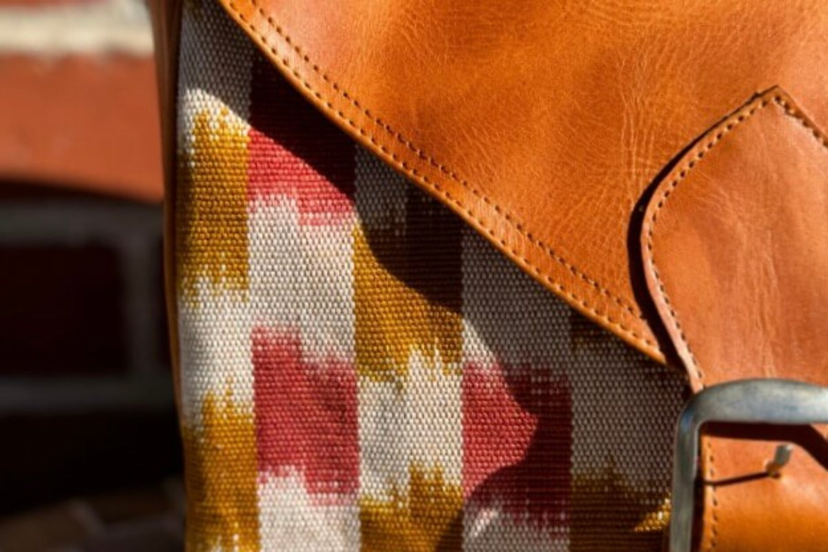 Bag with genuine leather and checkered rust colored design