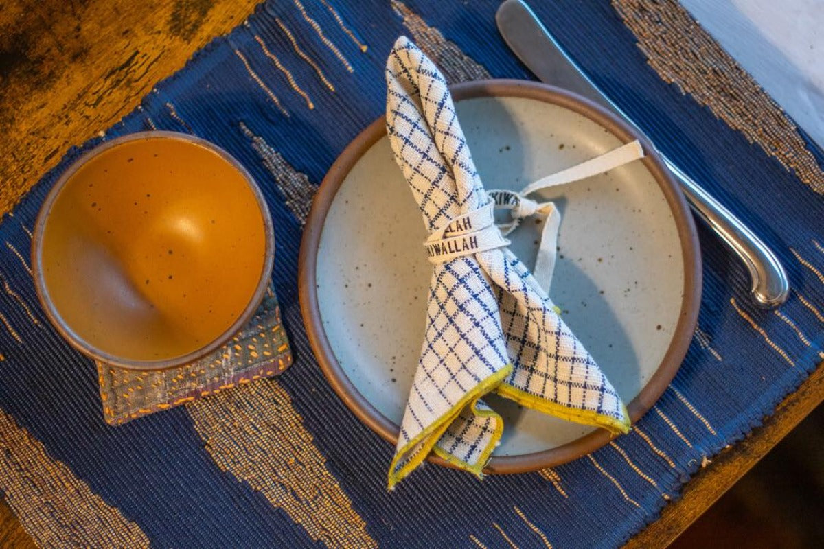 Place setting with blue handmade placemat