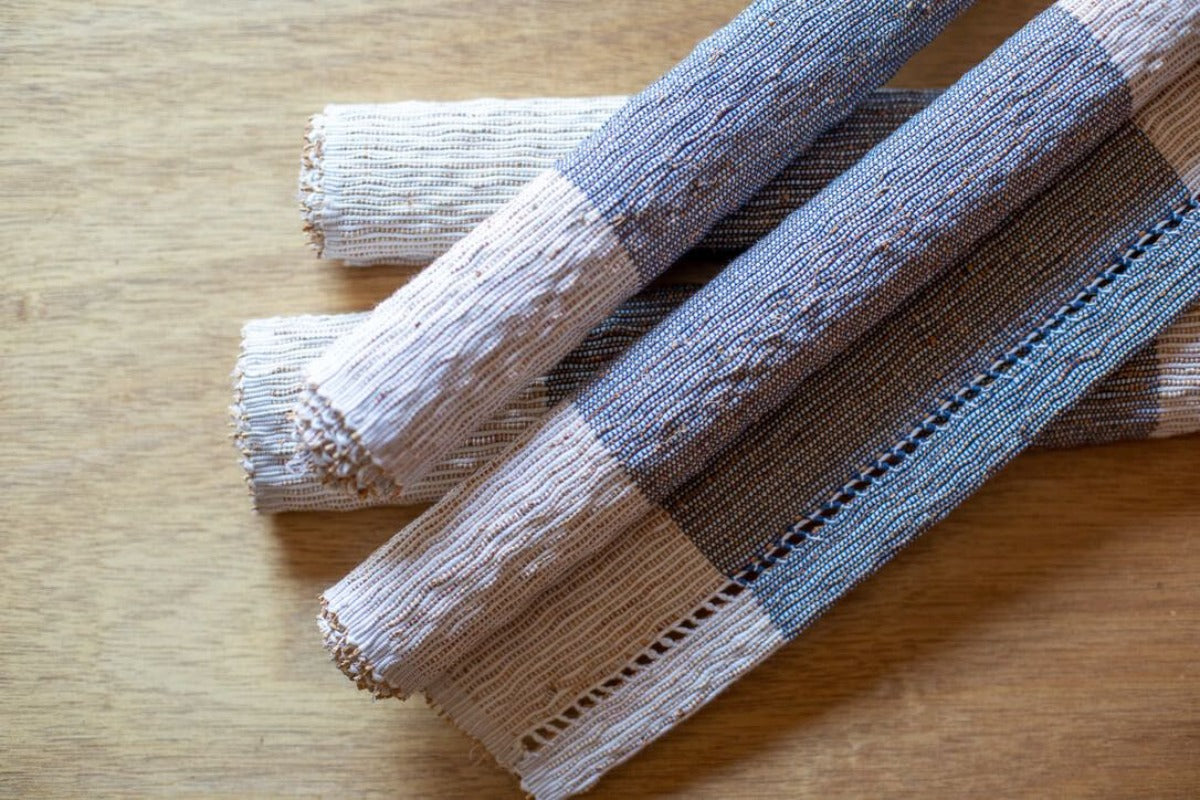 Ivory and blue placemat made of vetiver grass