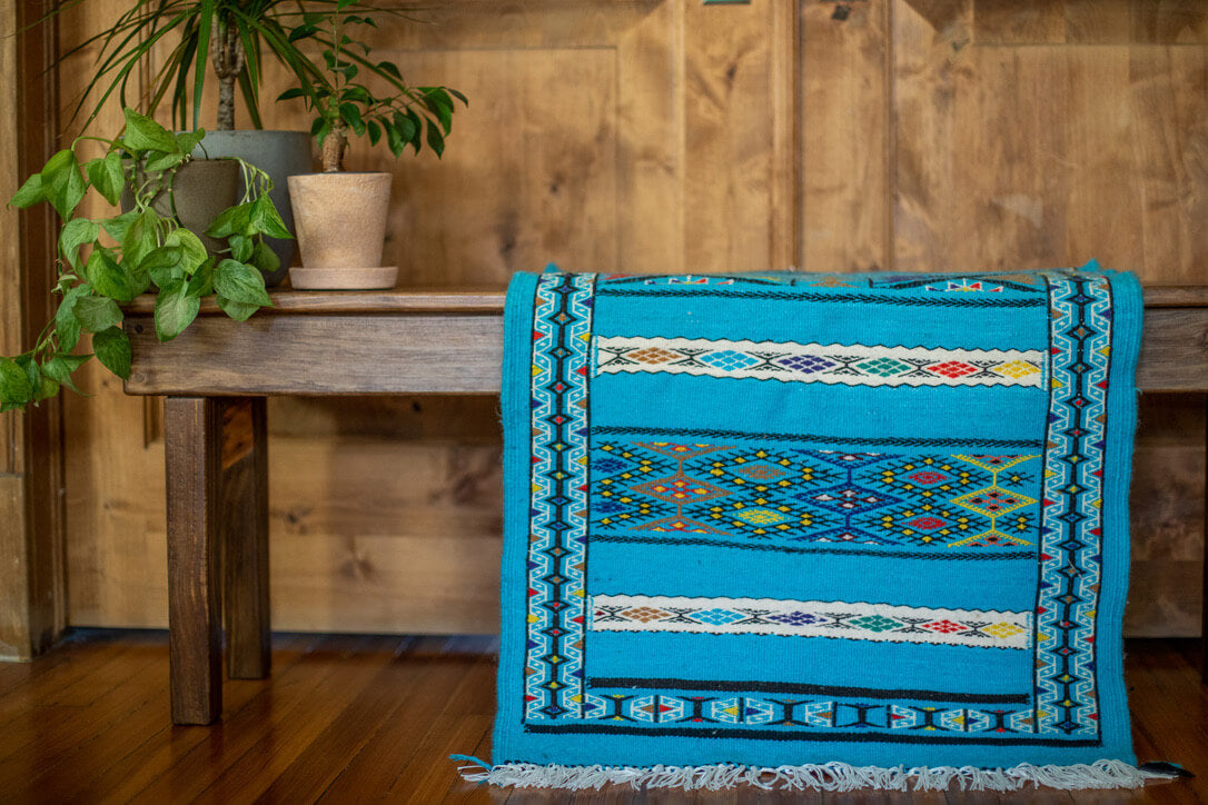 Light blue rug with geometric patterns