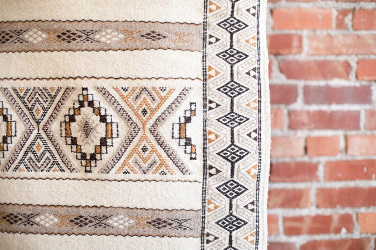 Close up of White rug with geometric pattern