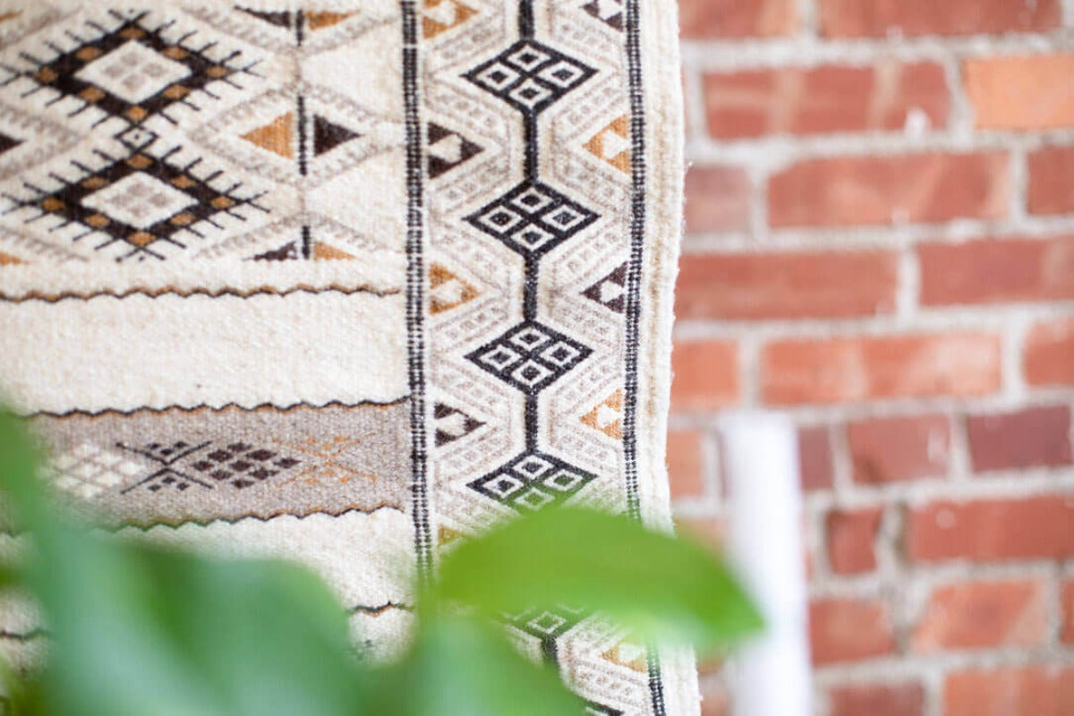Close up of white rug with geometric pattern