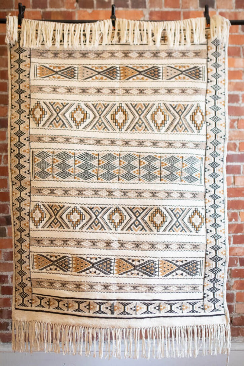 White rug with art-deco geometric patterns